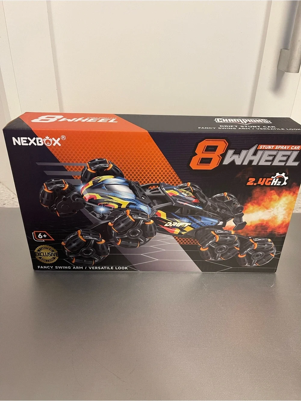 Nexbox 8-Wheel Stunt Spray RC Car - Black with Orange Accent NIP